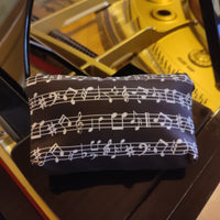 Faulenzer Kosmetiktasche Musiknoten schwarz