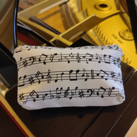 Faulenzer Kosmetiktasche Musiknoten weiß