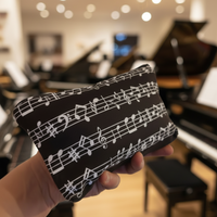 Faulenzer Kosmetiktasche Musiknoten schwarz
